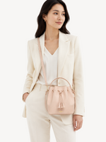 Soleil Drawstring Bucket Crossbody worn, shown for scale