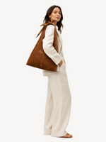 Siena Knot Suede Hobo worn, shown for scale